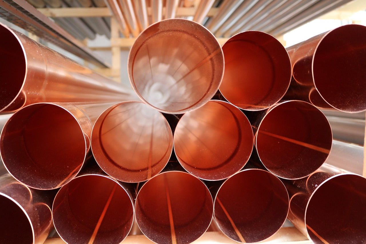 copper pipes on rack
